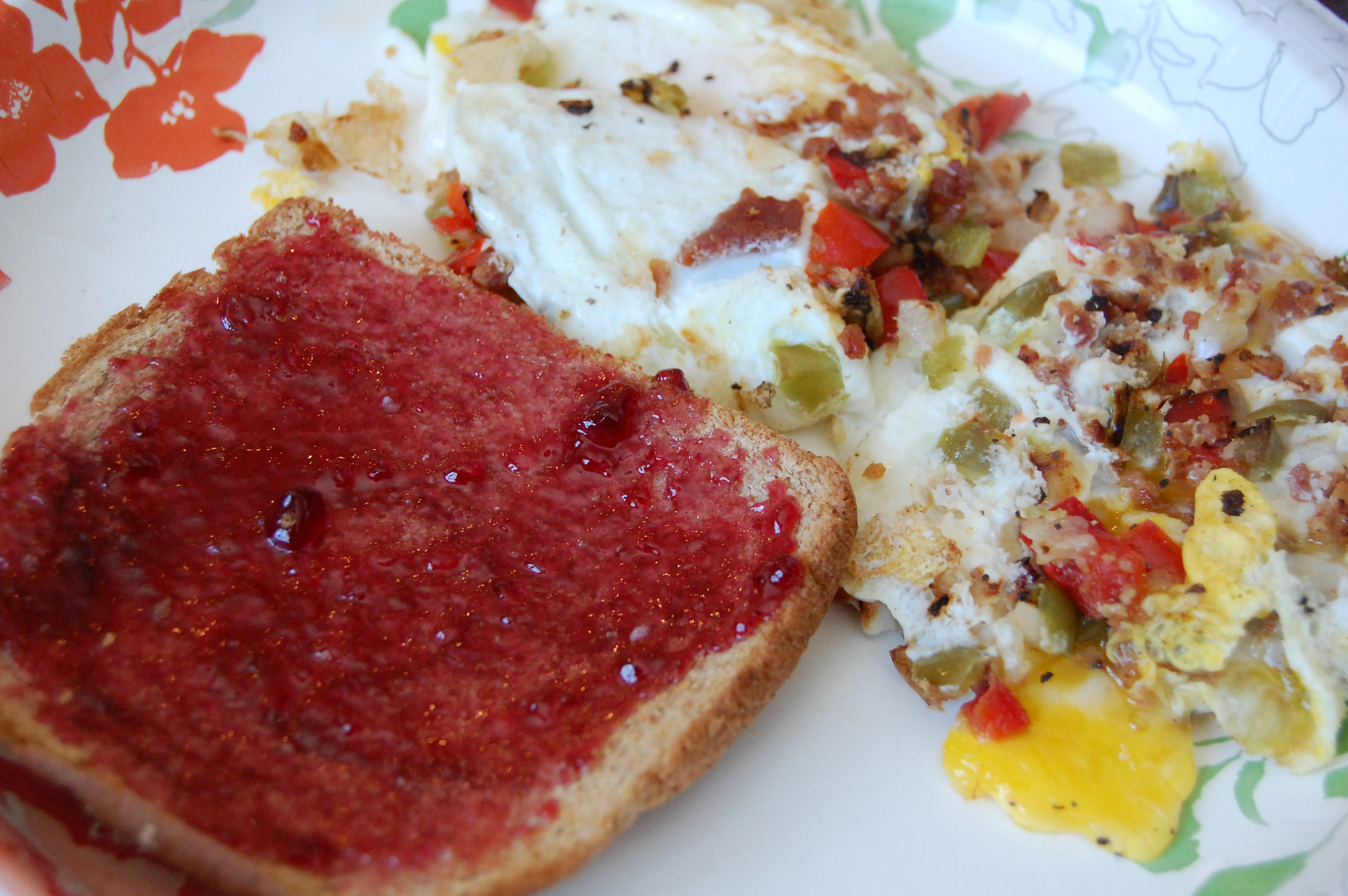 Fried eggs with onions, peppers and bacon